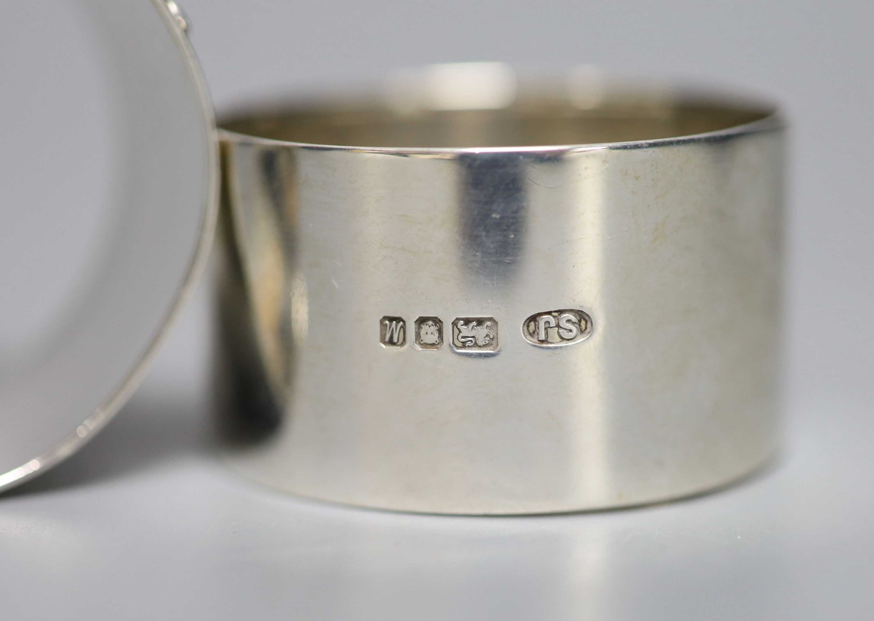 A modern pair of silver napkin rings cast with mice and wheatsheaf, by Sarah Jones, London, 1986, 45mm, 84 grams.